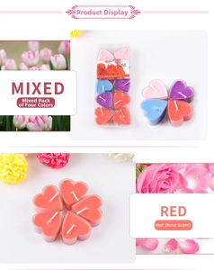 Dettaglio di candele profumate a forma di cuore in colori misti e aroma di rosa