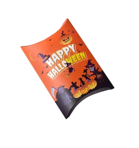 Macro view of a Halloween pillow gift box with festive orange and black illustrations