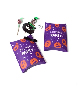 Macro detail of purple Halloween pillow boxes with pumpkin prints and decorative bows