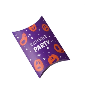 Macro view of purple Halloween pillow box with orange pumpkins and festive party patterns