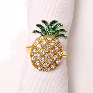 Detailed macro shot of golden pineapple napkin ring with sparkling rhinestones