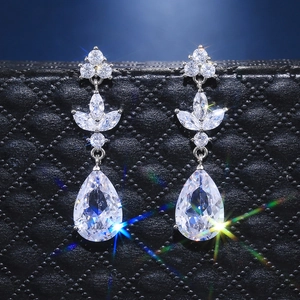 Elegant silver teardrop earrings featuring pear-cut zircon and floral leaf design