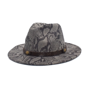 Fedoras hat with snake print and leather band with metal studs on white background