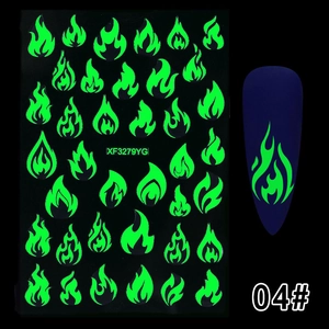 Luminous green flame nail art stickers showing detailed pattern on dark blue base nails