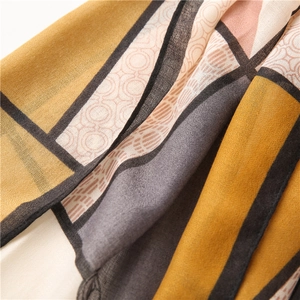 Macro shot of geometric pattern silk scarf showing detailed cotton linen fabric texture
