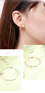 Detail of minimalist knot hoop earrings in gold and silver finish for women