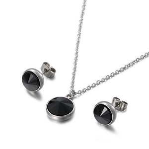 Elegant jewelry set with black zircon pendant necklace and stud earrings on white background