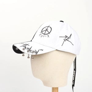 Detail of white hip-hop baseball cap with metal rings and printed black decorative ribbon