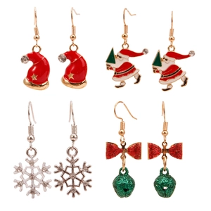 Close-up of Christmas earring set with Santa, hat, snowflake and bell charms