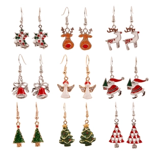 Detailed view of nine unique Christmas earrings including Santa, reindeer, and tree designs