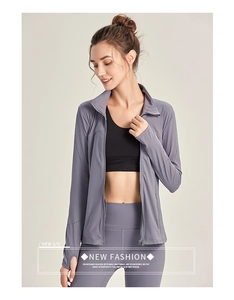 Close-up of women's sports jacket with zipper, breathable mesh, and thumbhole cuffs