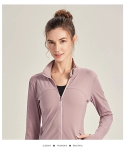 Detail of slim-fit zipper sports jacket with laser-cut breathability in dusty pink