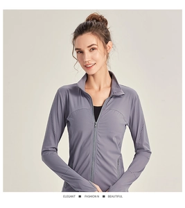 Detail view of grey slim fit sports jacket with laser-cut ventilation holes on sleeves