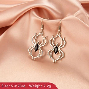 Silver and black spider earrings with size 5.3x2cm and weight 7.2g on silk backdrop