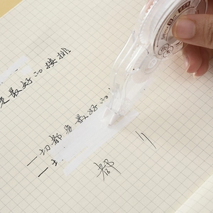 Handheld transparent correction tape 5mmx13m covering handwriting on grid paper