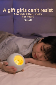 Cozy bedside cat night light with warm yellow glow and elegant wooden tripod legs