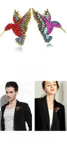 Detailed close-up of hummingbird brooch with colorful rhinestones on male and female models