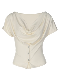 Detail of elegant cream satin T-shirt with draped cowl neck and silver metal buttons