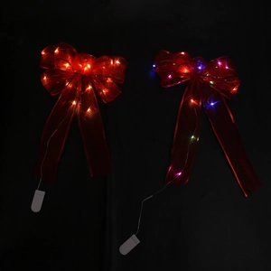 Detailed view of LED lighted Christmas bows with warm white and colorful glow modes