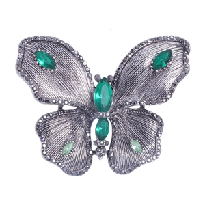 Elegant silver-tone alloy butterfly brooch with green crystals and sparkling rhinestones