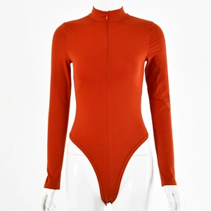 Detail of orange long-sleeve bodysuit featuring a front half-zipper and high-cut leg style