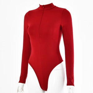 Detailed view of the red long sleeve bodysuit featuring a high collar and front zipper