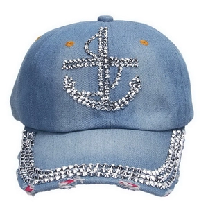 Detail of blue denim baseball cap with silver rhinestone anchor and distressed brim edge