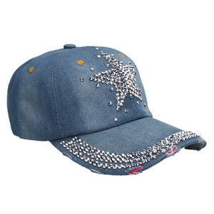 Detail of blue denim baseball cap with rhinestone star pattern and pink distressed brim