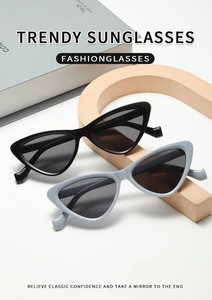 Detail view of stylish cat-eye sunglasses in black and grey-blue with arm model number