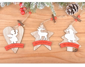 Detail view of wood Christmas ornaments with hearts and stars on natural rustic tabletop