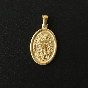 Detailed relief of San Miguel on an oval 18K gold-plated stainless steel pendant