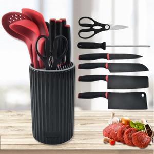 Comprehensive kitchen knife set with red silicone tools and black storage cylinder