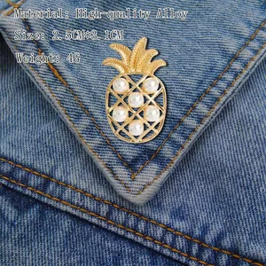Pineapple brooch with white pearls on denim jacket showing its 2.5CM size and quality alloy
