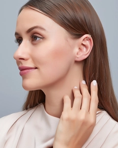 Detail of rose gold double layer ear cuff with micro-pave zircons worn on ear