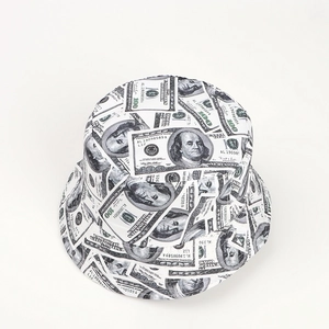Detail of street style reversible bucket hat with full 100 dollar bill print on white