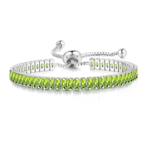 Adjustable tennis bracelet with rectangular green emerald stones and slider closure