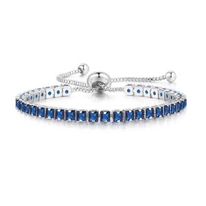 Detail of adjustable silver tennis bracelet with square blue crystals and slider clasp