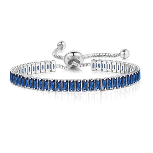 Detailed macro view of adjustable silver bracelet with pavé-set blue rectangular crystals