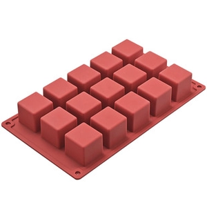 Detail view of a 15-cavity red food-grade silicone mold for square ice cubes and chocolate