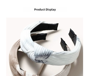 Detail of twisted knot headband with marble print pattern and ribbed knit texture fabric