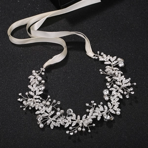Elegant bridal wedding sash featuring silver leaf metalwork with pearls and crystals