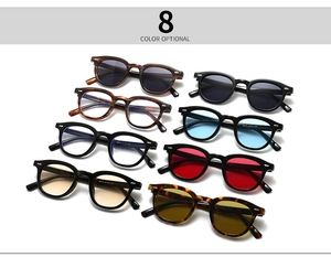 Flat lay of eight colorful rectangular retro eyeglasses with blue light blocking lenses