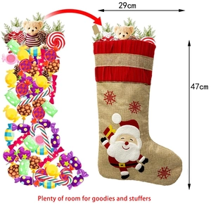 Detail of burlap Christmas stocking showing 29x47cm dimensions and large storage capacity