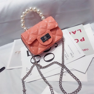 Mini pink PVC jelly bag with quilted pattern, pearl handle, and silver chain strap