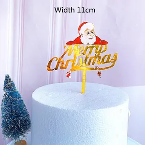 Merry Christmas acrylic cake topper with Santa graphic and gold mirror finish, 11cm wide