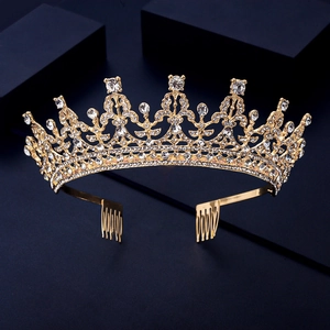 Detailed view of luxury gold bridal crown with crystal rhinestones and side hair combs