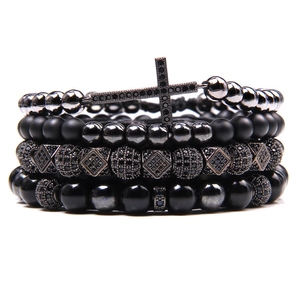 Stack of 4 natural stone bracelets featuring a cross charm and black zircon beads