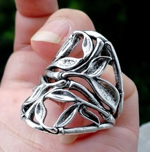 Macro shot of vintage silver leaf open ring with detailed tree branch pattern for men