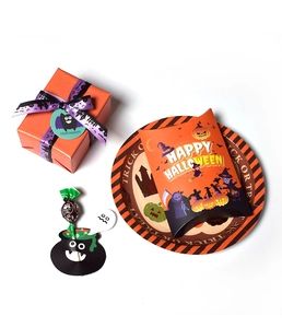 Close-up of Halloween gift boxes and candy packaging with pumpkin and ghost motifs
