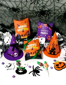Halloween gift boxes including orange pillow boxes and purple witch hat shaped paper packaging
